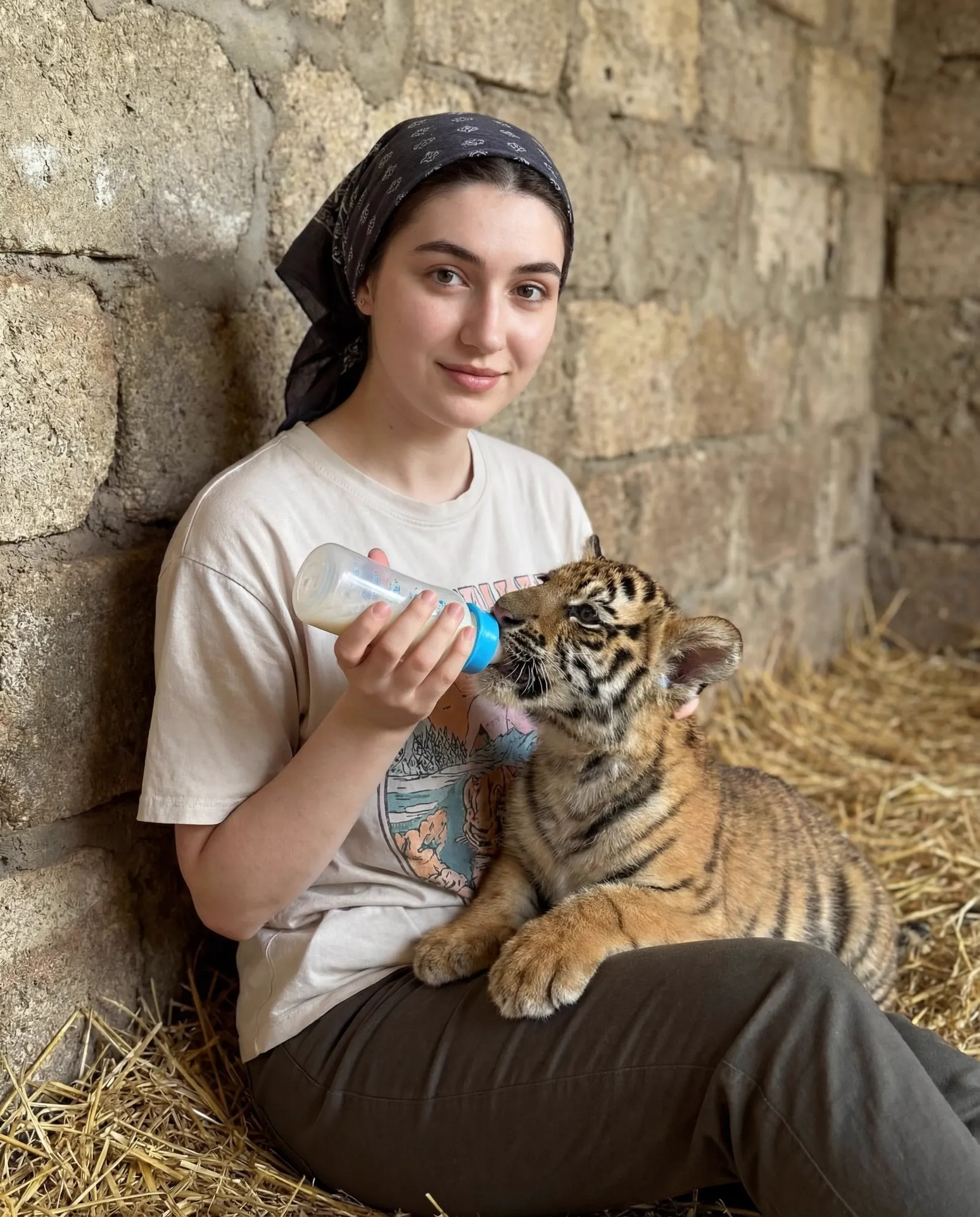 { "scene_type": "lifestyle portrait with animal interaction", "composition": {…