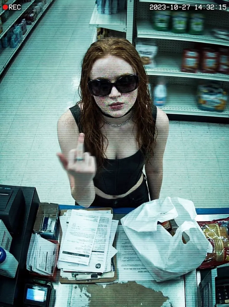 { "image_description": { "title": "Surveillance Feed: Defiant Subject in Retail… — 3/4