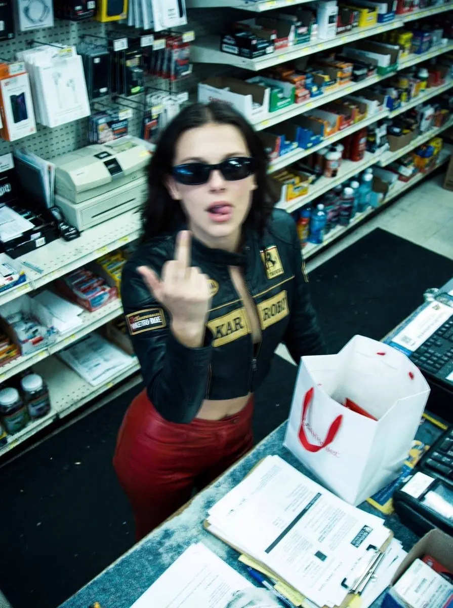 { "image_description": { "title": "Surveillance Feed: Defiant Subject in Retail… — 4/4