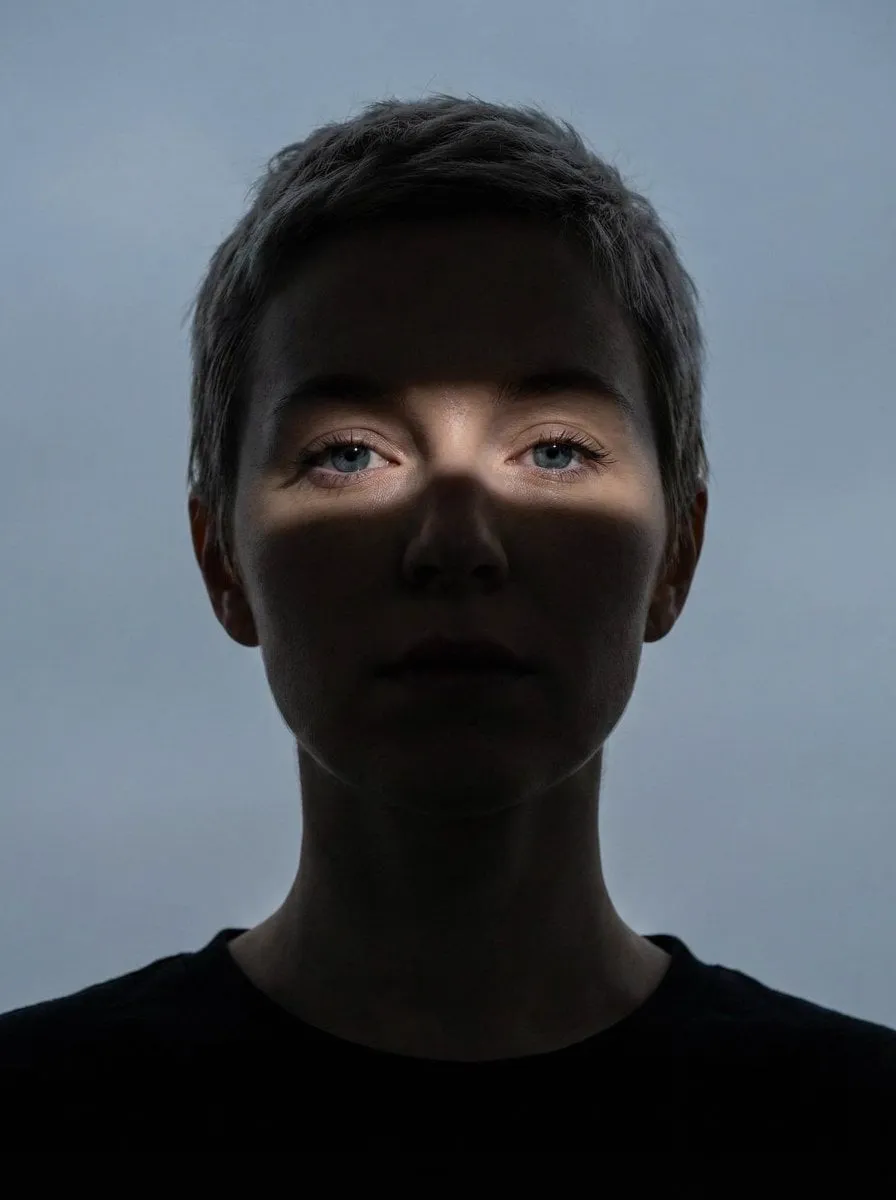 Close-up portrait of a woman (Same face as reference image)looking directly at… — 1/2