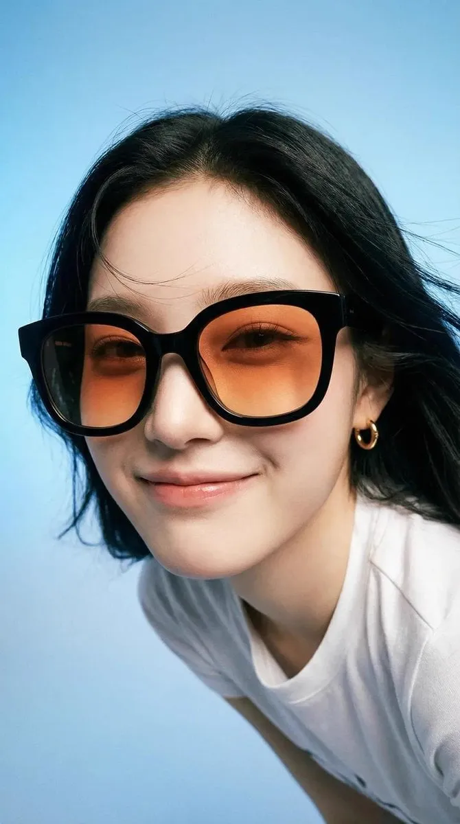 Photorealistic editorial portrait of a smiling woman using the exact same face…