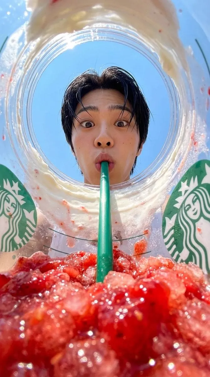 { "prompt": "View from inside a Starbucks strawberry frappuccino cup looking… — 2/2