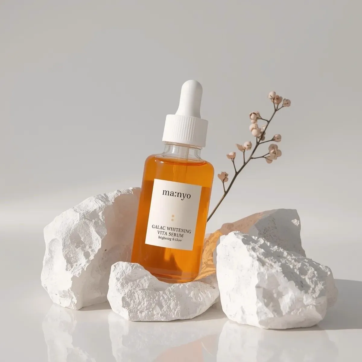 Minimalist studio product photography of an amber glass dropper serum bottle… — 1/4