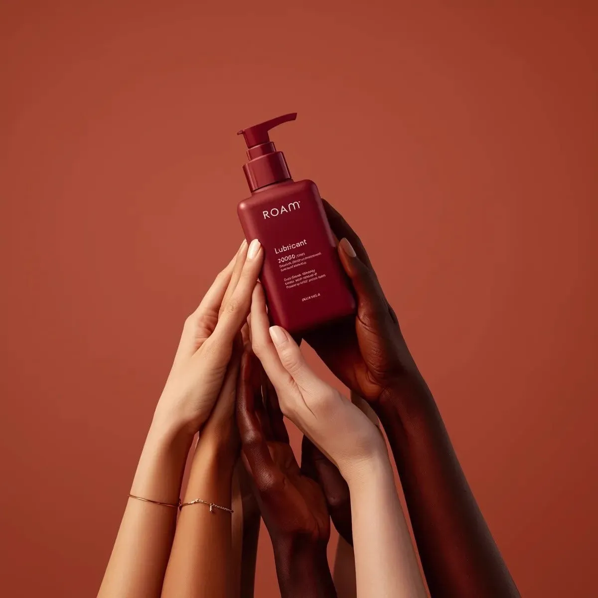 Minimalist product photography of a matte red pump bottle labeled ‘ROAM… — 1/2
