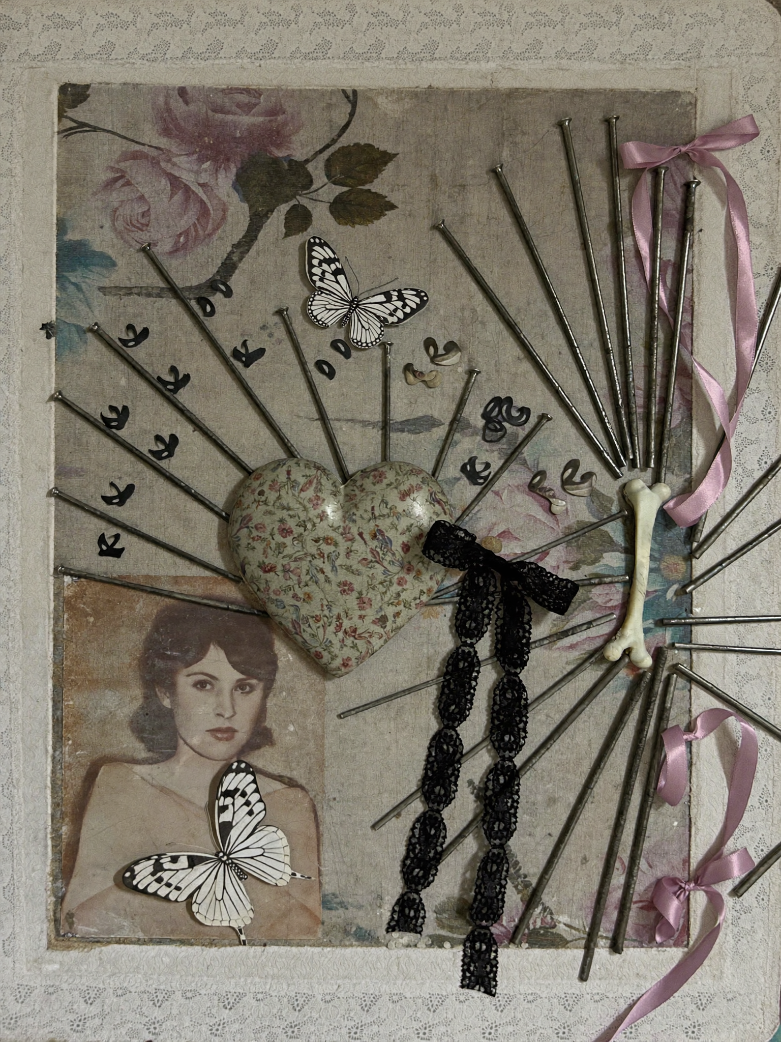 A straight-on view of a mixed-media artwork featuring a weathered, vintage...